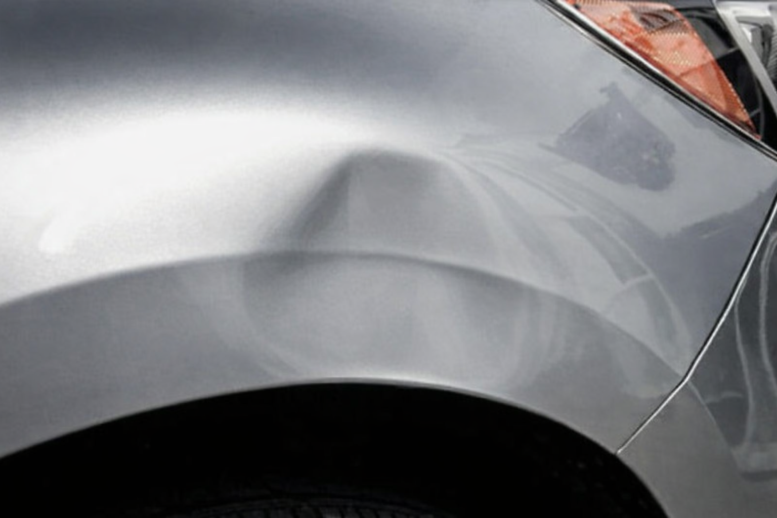 Vehicle dent before repair - door ding damage